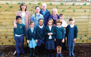 L-R: Marieke Strange, chair of Brunel Field PSA; Klare and Time Percival, directors of Strawberry Property who donated the funds for the wall; Julie Waldren, assistant headteacher at Brunel Field